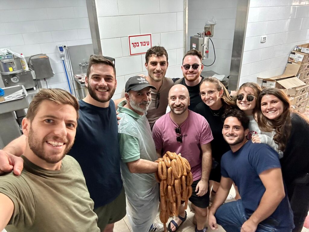 The JLIC Tel Aviv's community purchased meat at a butcher in the south to supply their night of grilling for soldiers near the Gaza border.