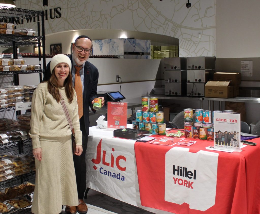 Rabbi Aaron and Miriam Greenberg collecting cans for the food pantry